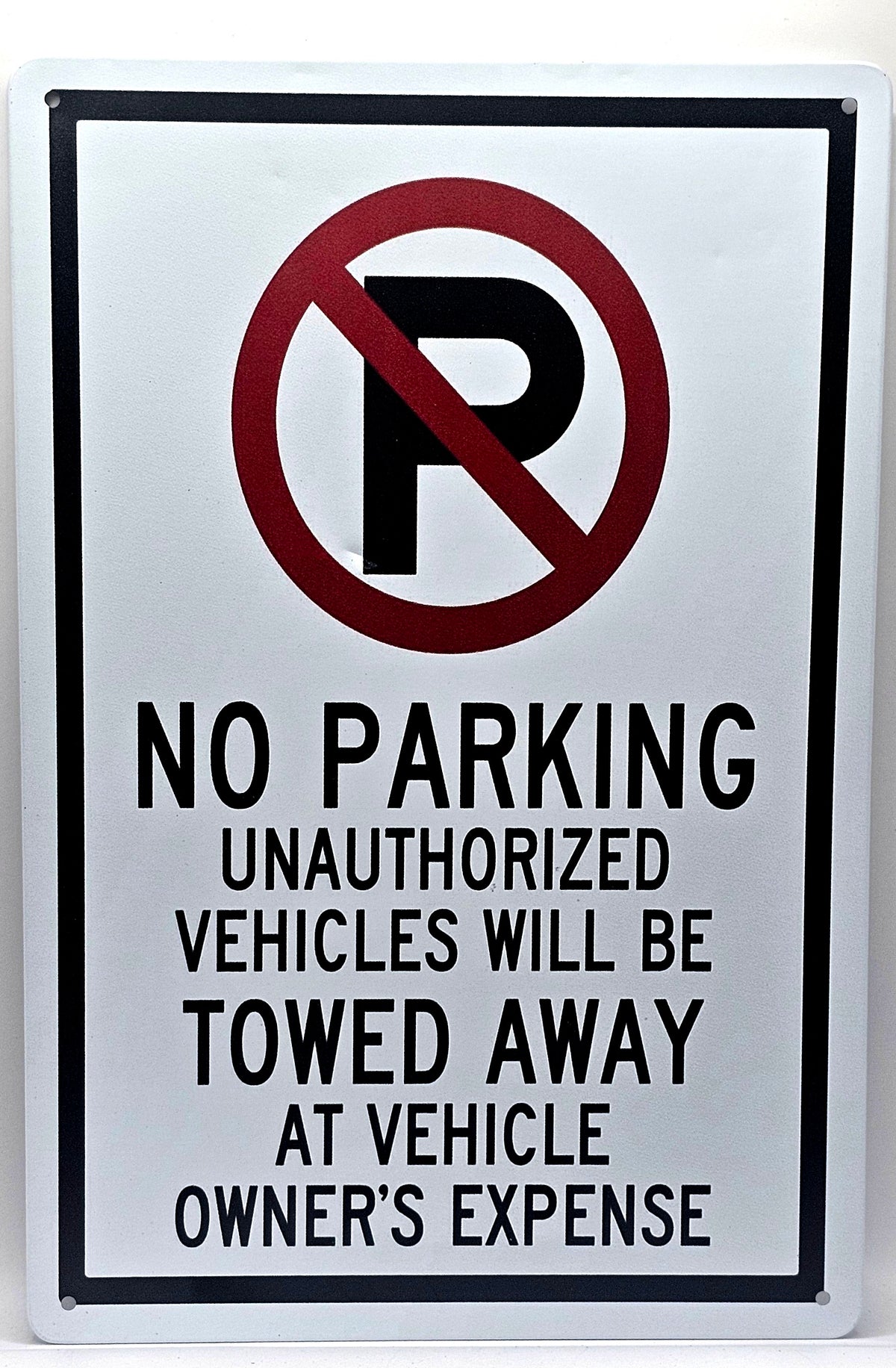 No Parking, Unauthorized Vehicles Will Be Towed Away At Owners Expense
